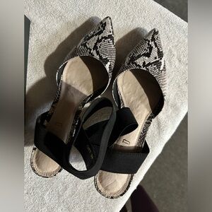 Silent D. Low sling heel.